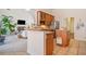 Open kitchen with breakfast bar and views into Gathering room at 2311 Shoreline Pkwy, Villa Rica, GA 30180