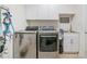 Laundry room with washer, dryer, and utility sink at 2311 Shoreline Pkwy, Villa Rica, GA 30180