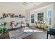 Sunlit sitting room with bay window and hardwood floors at 2311 Shoreline Pkwy, Villa Rica, GA 30180