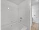 White tiled bathroom with bathtub at 3040 Peachtree Rd # 614, Atlanta, GA 30305