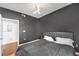 Bedroom with dark walls, hardwood floors, and balcony access at 3040 Peachtree Rd # 614, Atlanta, GA 30305