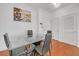Bright dining area with glass table and four black chairs at 3040 Peachtree Rd # 614, Atlanta, GA 30305
