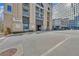 Luxury condo building with modern exterior and ample parking at 3040 Peachtree Rd # 614, Atlanta, GA 30305