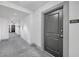 Apartment hallway with grey carpet and doors at 3040 Peachtree Rd # 614, Atlanta, GA 30305