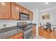 Modern kitchen with stainless steel appliances and granite countertops at 3040 Peachtree Rd # 614, Atlanta, GA 30305