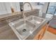 Stainless steel double sink with modern faucet at 3040 Peachtree Rd # 614, Atlanta, GA 30305