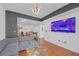 Open living room, hardwood floors, and modern decor at 3040 Peachtree Rd # 614, Atlanta, GA 30305