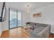 Living room with sectional sofa and access to balcony at 3040 Peachtree Rd # 614, Atlanta, GA 30305