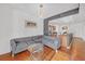 Living room with gray sectional sofa and hardwood floors at 3040 Peachtree Rd # 614, Atlanta, GA 30305