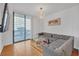 Living room with sectional sofa and access to balcony at 3040 Peachtree Rd # 614, Atlanta, GA 30305