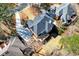 A bird's eye view of a beautiful brick home with a large backyard and deck area at 1105 River Laurel Dr, Suwanee, GA 30024