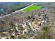 Aerial view of a home in a neighborhood with a green space, providing privacy and natural beauty at 1105 River Laurel Dr, Suwanee, GA 30024