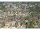 Aerial view of a home nestled in a wooded community with beautiful landscaping at 1105 River Laurel Dr, Suwanee, GA 30024