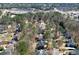 Aerial view of a charming neighborhood nestled amongst mature trees and lush landscaping at 1105 River Laurel Dr, Suwanee, GA 30024