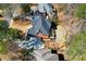 Aerial view showcasing a beautiful brick home with a well maintained landscape and backyard at 1105 River Laurel Dr, Suwanee, GA 30024