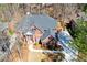 Stunning aerial view of a beautiful brick home with a well-manicured lawn at 1105 River Laurel Dr, Suwanee, GA 30024