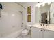 Bathroom featuring a white tiled shower, tub, toilet, and a single vanity at 1105 River Laurel Dr, Suwanee, GA 30024
