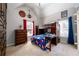 Spacious bedroom featuring built-in bunk beds, a dresser, and two windows providing natural light at 1105 River Laurel Dr, Suwanee, GA 30024