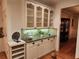 Elegant dining area with granite countertop, cabinets and glass front shelving at 1105 River Laurel Dr, Suwanee, GA 30024