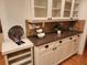 Elegant dining area with granite countertop, cabinets and glass front shelving at 1105 River Laurel Dr, Suwanee, GA 30024