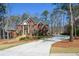 Two-story brick home with an attached garage and a well-maintained front yard at 1105 River Laurel Dr, Suwanee, GA 30024