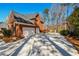 Lovely brick home with a spacious driveway and an attached two-car garage at 1105 River Laurel Dr, Suwanee, GA 30024