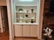 Built-in bookcase displaying decorative items in a cozy living room setting at 1105 River Laurel Dr, Suwanee, GA 30024