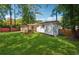 Spacious backyard with grassy area and screened porch at 1464 Sanden Ferry Dr, Decatur, GA 30033