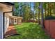 Large backyard with lush lawn and screened porch at 1464 Sanden Ferry Dr, Decatur, GA 30033