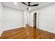 Well-lit bedroom with hardwood floors and ceiling fan at 1464 Sanden Ferry Dr, Decatur, GA 30033