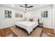 Large bedroom with hardwood floors, ceiling fan, and ample natural light at 1464 Sanden Ferry Dr, Decatur, GA 30033