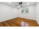 Bright bedroom with hardwood floors and ceiling fan at 1464 Sanden Ferry Dr, Decatur, GA 30033