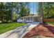 Newly renovated Ranch home with a modern front door and driveway at 1464 Sanden Ferry Dr, Decatur, GA 30033