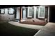 Charming house exterior with updated landscaping at night at 1464 Sanden Ferry Dr, Decatur, GA 30033