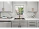 Modern kitchen with white cabinets and quartz countertops at 1464 Sanden Ferry Dr, Decatur, GA 30033