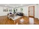 Living room with hardwood floors, modern decor, and large windows at 1464 Sanden Ferry Dr, Decatur, GA 30033