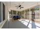Relaxing screened porch with seating area and ceiling fan at 1464 Sanden Ferry Dr, Decatur, GA 30033