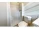 Bathroom with a stand-up shower and toilet at 24 Valerie Ln, Powder Springs, GA 30127