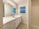 Clean bathroom with a shower/tub combo and updated vanity at 24 Valerie Ln, Powder Springs, GA 30127