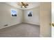Bright bedroom featuring neutral carpeting and dual windows at 24 Valerie Ln, Powder Springs, GA 30127
