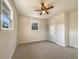 Cozy bedroom with carpet, window, and ceiling fan at 24 Valerie Ln, Powder Springs, GA 30127