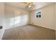 Spacious bedroom with neutral carpeting and ceiling fan at 24 Valerie Ln, Powder Springs, GA 30127