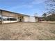 Side view of the house with a carport and yard at 24 Valerie Ln, Powder Springs, GA 30127