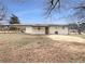 Back of house with carport and spacious yard at 24 Valerie Ln, Powder Springs, GA 30127