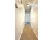 Long hallway with carpeted floor and neutral walls at 24 Valerie Ln, Powder Springs, GA 30127