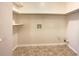 Laundry room with ample shelving and vinyl flooring at 24 Valerie Ln, Powder Springs, GA 30127