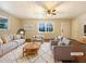 Virtually staged living room with neutral furniture and hardwood floors at 24 Valerie Ln, Powder Springs, GA 30127