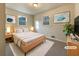 Virtually staged main bedroom with light walls and plush bedding at 24 Valerie Ln, Powder Springs, GA 30127
