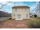 View of the backyard of this charming home, featuring a sliding door and compact yard at 7015 Setters Way, Lithonia, GA 30038