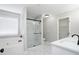 Bathroom featuring a separate shower and tub, modern fixtures, and stylish marble tile flooring at 7015 Setters Way, Lithonia, GA 30038